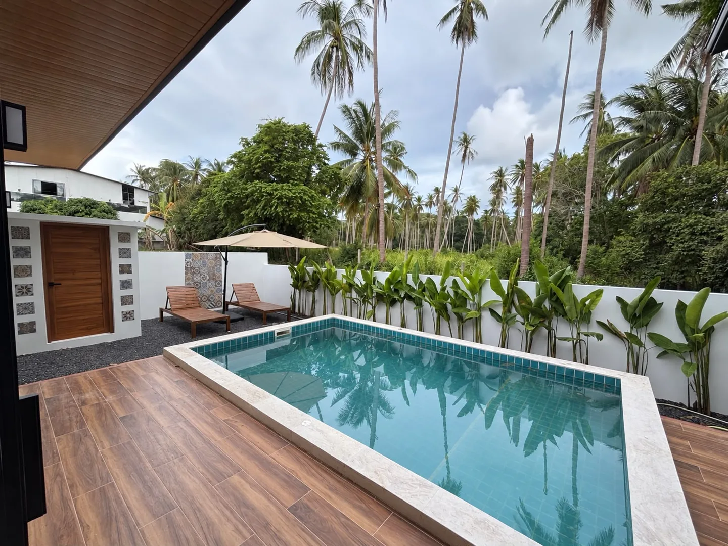 Private swimming pool and timber terrace at the completed Maenam villa